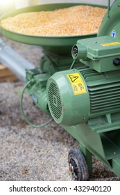 Close Up Of Grinding Mill And Container Full Of Corn