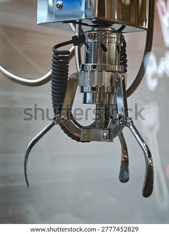 Close up of gripper, automatic crane toy
