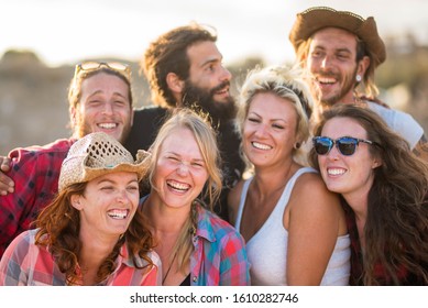 Close Up Of Group Of Adults And People Having Fun Together And Looking At The Camera Smiling