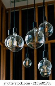 Close Up Group Of Beautiful Round Shape Light Bulb From Ceiling, Transparent Hanging Glass Light Bulbs For Interior Decoration, Vertical Image.