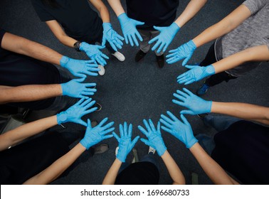Close up group of hand with medical glove present Collaborate and teamwork, Volunteers hand 
