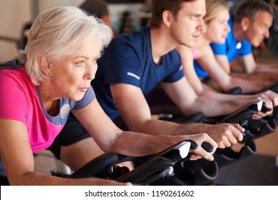 Close Up Of Group Taking Spin Class In Gym