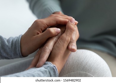 Close Up Of Grown Up Daughter Holding Hand Of Mother, Shares All Hardship And Illness Of Dear Person, Concept Of Express Care, Giving Psychological Support, Trust Empathy And Understanding In Family