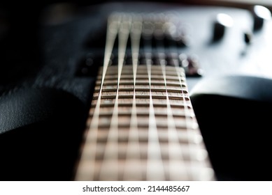 close up of a guitar, blurred focus	
