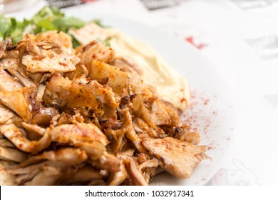 Close up of Gyros or Gyro, Greek dish made of meat cooked on a vertical rotisserie, traditionally pork, or chicken