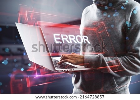Close up of hacker hands with abstract red error hologram. Connection and crime concept. Double exposure