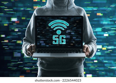 Close up of hacker hands holding laptop with 5G glitchy icon hologram on blurry background. 5th Generation Wireless Internet Network connection information technology illustration, hacking concept.