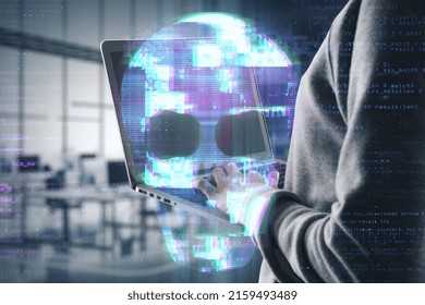 Close up of hacker hands using laptop with abstract digital skull hologram on blurry office interior background. Hacking, malware and phishing concept. Double exposure