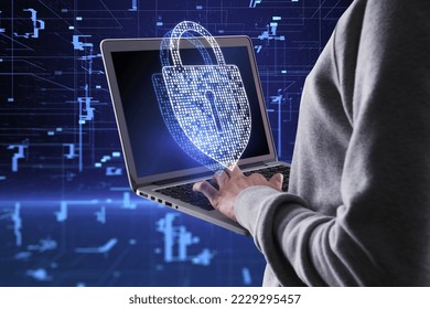Close up of hacker hands using laptop with creative glowing digital padlock hologram on blurry dark background. Secure, hacking, safety and protection concept