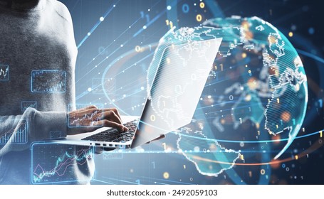 Close up of hacker hands using laptop with creative binary coding globe on blurry background. World map and global business technologies concept. Double exposure