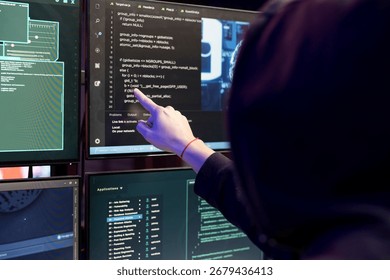 Close up of hacker in secret bunker coding on PC, using AI to evade security with stealth malware. Evil man in underground lair using script on computer to hide malicious code from detection systems