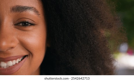 Close up half face young African American woman girl toothy dental smile happy female expression emotion joy beauty portrait lady businesswoman student detail cosmetic makeup laugh positive clean skin - Powered by Shutterstock