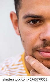 Close up half frame portrait thinking young african american man