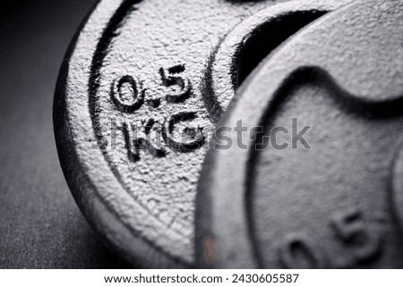 Close up of half kilogram metal dumbbells to strengthen muscles.
