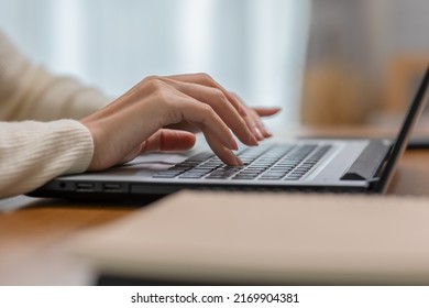 Close Up Hand Of Business Woman Typing On Keyboard Working With Computer Laptop. Hands Of Woman Chatting Or Writing Article On Work Table At Home. B Roll Typing To Communication On Computer