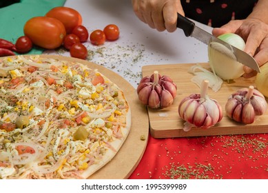 Close Up hand of chef baker making pizza in the kitchen.