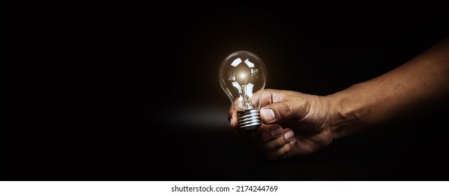 Close Up Hand Choose Light Bulb Or Lamp For Human Resources Or Leadership And Creativity Thinking Idea Motivation Or Vision And Knowledge Learning And Study Or Education Concept.