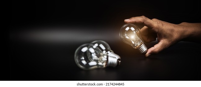 Close Up Hand Choose Light Bulb Or Lamp For Human Resources Or Leadership And Creativity Thinking Idea Motivation Or Vision And Knowledge Learning And Study Or Education Concept.