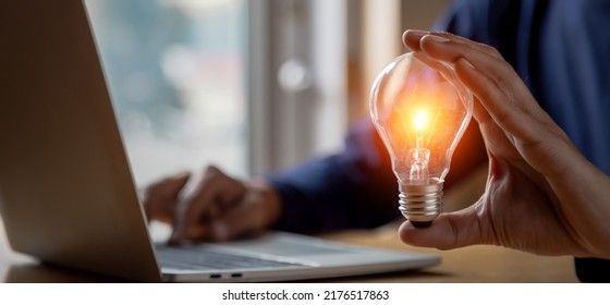 Close Up Hand Choose Light Bulb Or Lamp With Bright For Human Resources Or Leadership And Creativity Thinking Idea Motivation Or Vision And Knowledge Learning.