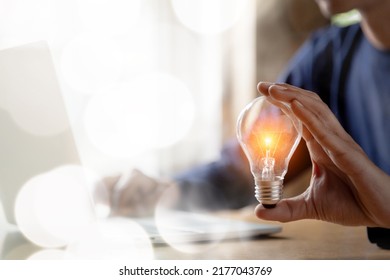 Close Up Hand Choose Light Bulb Or Lamp With Bright For Human Resources Or Leadership And Creativity Thinking Idea Motivation Or Vision And Knowledge Learning.