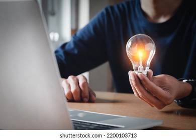 Close Up Hand Choose Light Bulb Or Lamp With Bright For Human Resources Or Leadership And Creativity Thinking Idea Motivation Or Vision And Knowledge Learning.