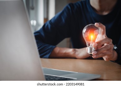 Close Up Hand Choose Light Bulb Or Lamp With Bright For Human Resources Or Leadership And Creativity Thinking Idea Motivation Or Vision And Knowledge Learning.