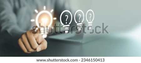 Close up hand choose light bulb or lamp with bright for human resources or leadership and creativity thinking idea motivation or vision and knowledge learning.