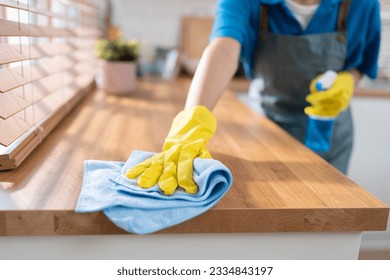 Close up hand cleaning home and wiping with microfiber cloth in kitchen room at home	 - Powered by Shutterstock