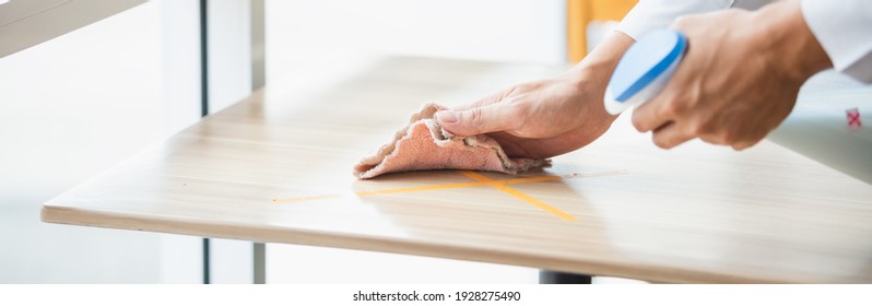 Close Up Hand With Cloth Wipping Cleanning Wood Table Restaurant. Employee Cleaning At Workplace. Banner Size Concept.