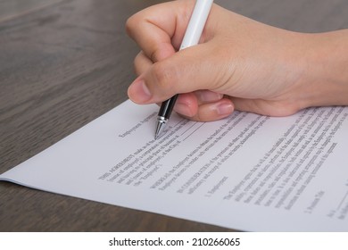 Close Up Of Hand Completing An Employment Application Form