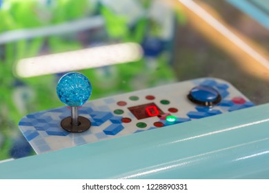 Close up hand control joystick of arcade