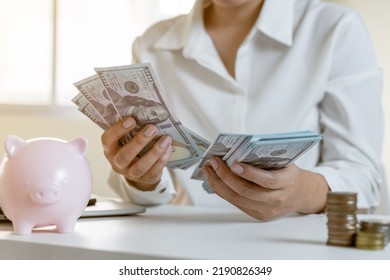 Close up hand counting money cash for saving, planning salary concept. - Shutterstock ID 2190826349