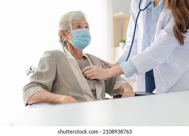 Close Up Hand Of Doctor, Asian Doctor Use Stethoscope Listening Lung Of Patient, Elderly Health Check Up , They Wear Surgical Mask On White Background, Corona Virus 