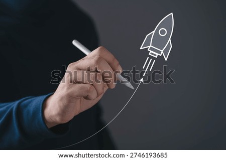 Close up of hand drawing rocket launch icon with stylus, symbolizing startup growth, innovation strategy, business launch and creative vision. Entrepreneur success and rapid development concept.