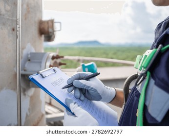 Close up hand engineer Report working  management air pollution reduction, continuous emission monitoring system factory and industry manufacturing. Clean air Eco friendly. Environment sustainable.