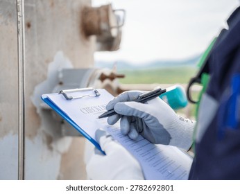 Close up hand engineer Report working  management air pollution reduction, continuous emission monitoring system factory and industry manufacturing. Clean air Eco friendly. Environment sustainable.