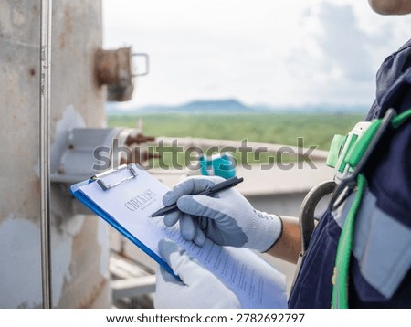 Close up hand engineer Report working  management air pollution reduction, continuous emission monitoring system factory and industry manufacturing. Clean air Eco friendly. Environment sustainable.