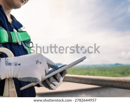 Close up hand engineer using digital tablet management air pollution reduction, continuous emission monitoring system factory and industry manufacturing. Clean air Eco friendly. Environment sustainable