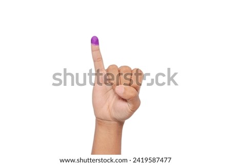 Close up of hand gesture little finger after voting. General elections or Pemilu for the president and government of Indonesia. The finger dipped in purple ink. Isolated image on white background