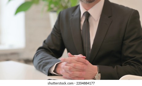 Close Up Of Hand Gesture Of Middle Aged Man Talking, Explaining