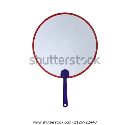 Close up of a hand held fan isolated on white background, selective focus. Clipping path included.