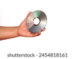 Close up hand hold CD compact disc, DVD, isolated on white background. Concept, tool, equipment for setup or install programs in computer or music, movie for dvd player.                             