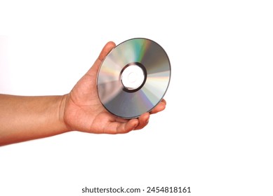 Close up hand hold CD compact disc, DVD, isolated on white background. Concept, tool, equipment for setup or install programs in computer or music, movie for dvd player.                             