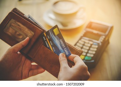 Close up of hand hold credit card to pay. Online payment . Paying by credit card - Shutterstock ID 1507202009