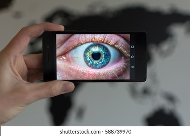 Close Up Hand Hold Smartphone As Eye Scanner For Security Measures, For Instance Unlocking Your Phone With The Iris Scan.