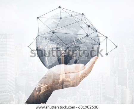 Close up of hand holding abstract globe with connections on city background. Global business concept. Double exposure