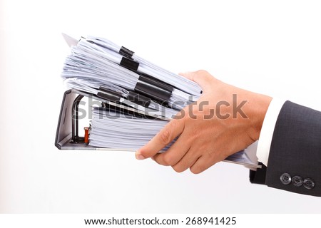 close up of hand holding binder on white background
