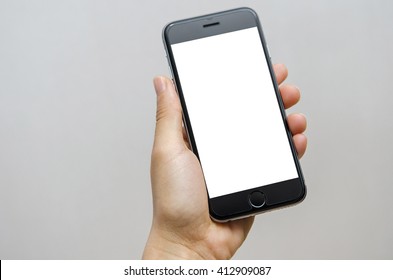 Close up hand holding black phone on white clipping path inside. - Shutterstock ID 412909087