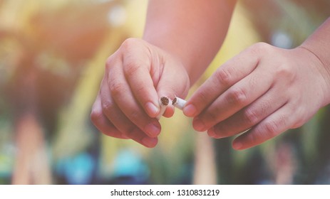 close up hand holding and breaking cigarette, no smoking, 31 may, medical and healthcare, world health day concept, vintage tone - Shutterstock ID 1310831219