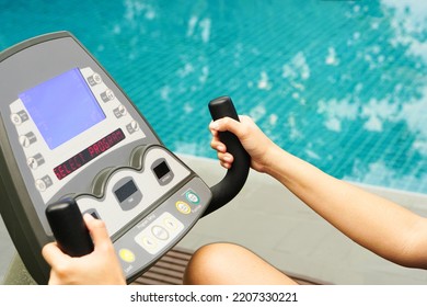 Close Up Of Hand Holding A Electric Bike Exercise Machine In Fitness.